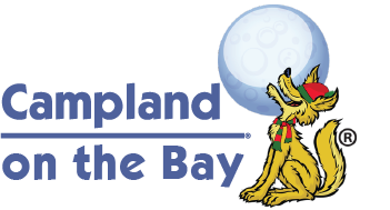 Campland on the Bay logo with Friendly in a holiday hat and scarf