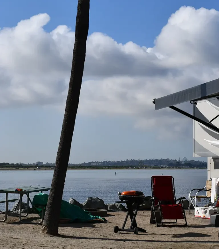 Campland beachfront RV site with RV in the P section